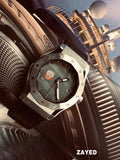 Luxury watch with detailed design on a textured surface, featuring the brand 'Zayed'.