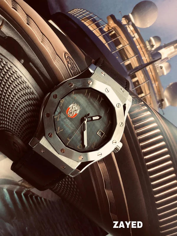 Luxury watch with detailed design on a textured surface, featuring the brand 'Zayed'.