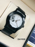 Black watch with a white face featuring a dog design, displayed in an open box with 'Zayed' branding.